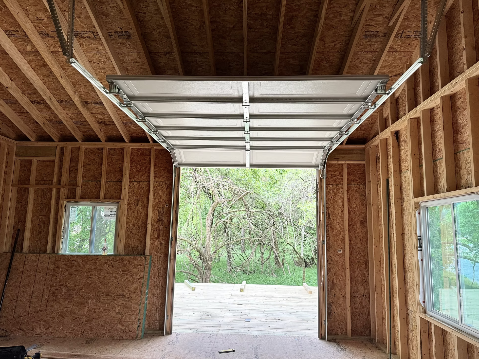 Black garage door new construction Central AR