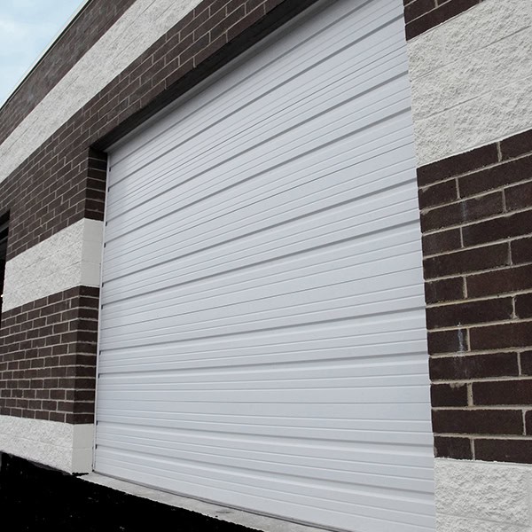 Commercial sectional overhead door installed on a steel building in Central Arkansas