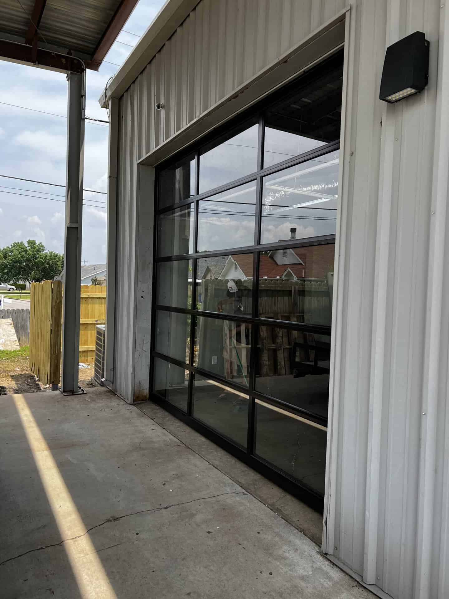 Full-view aluminum and glass commercial door installed by Direct Service